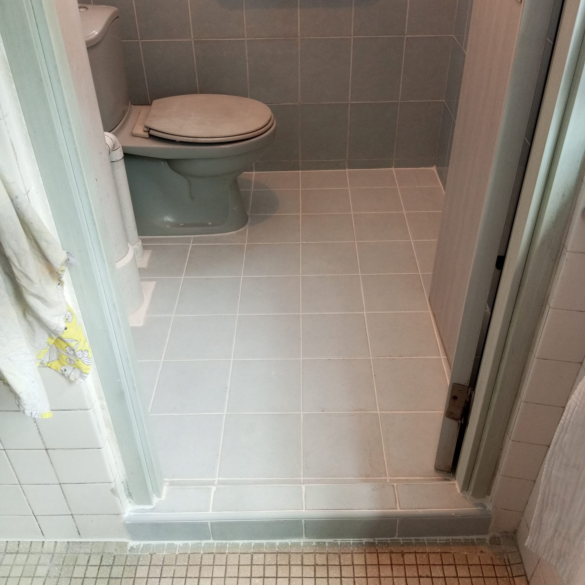 After: Clean refreshed grout lines in bathroom