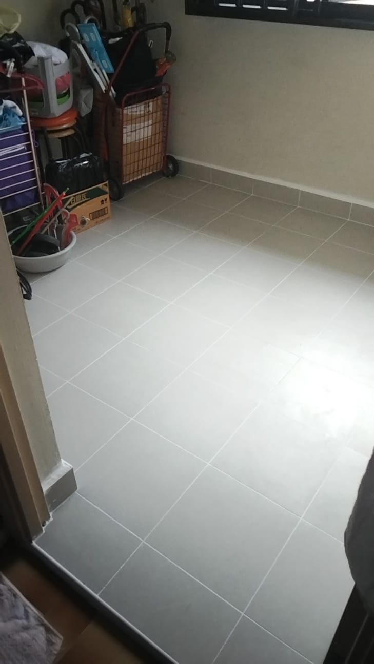 After: New grey floor tiles installed in HDB room